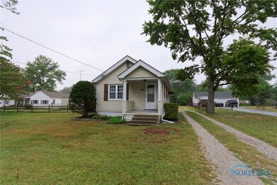 FRONT VIEW WITH DRIVEWAY