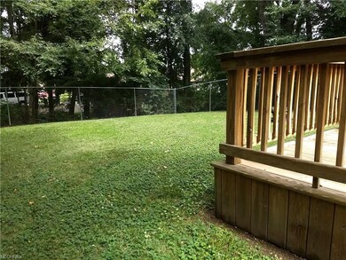 Wooded boundary leads to a nice private lot.
