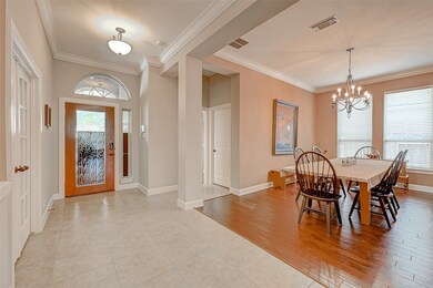Formal dining with high ceilings and elegant lighting.