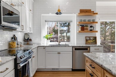 Kitchen with appliances with stainless steel finis