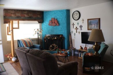 LIVINGROOM SHOWING FIREPLACE