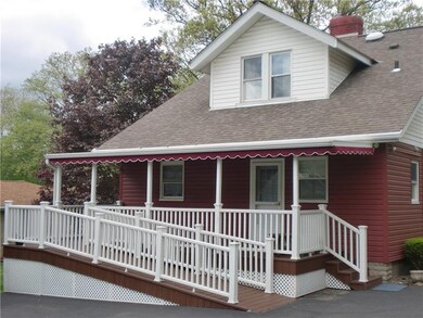 Relax on the inviting back porch while the kids ha
