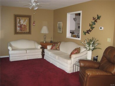 Kitchen has opening to living room.