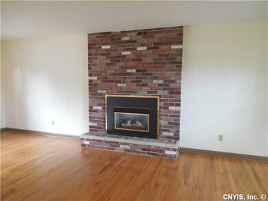 Living Room. The gas fireplace with its brick from