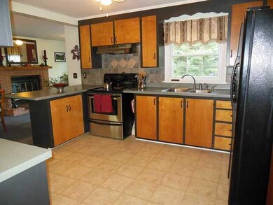 Kitchen open with new backsplash and updated floor