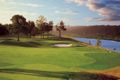 View of community with a water view and view of golf course