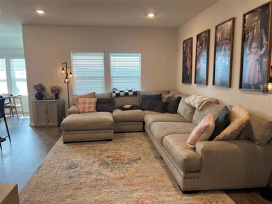 Living area featuring wood finished floors and re
