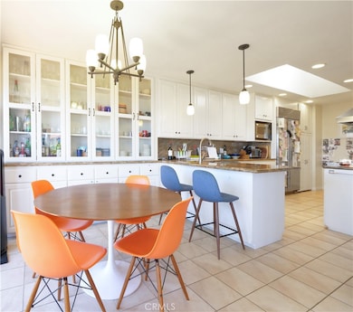Breakfast area facing toward kitchen and other side faces the view