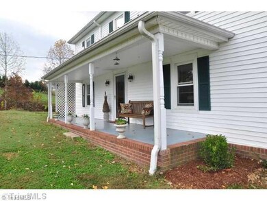 Exterior Front. Charming front porch. There are views of the surrounding foothills and Pilot Mountain from the property.