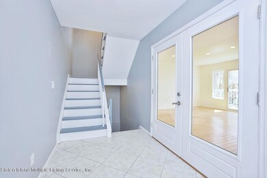 entry with stair to basement and living