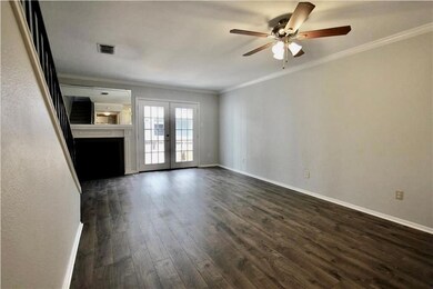 Unfurnished living room featuring ceiling fan, da