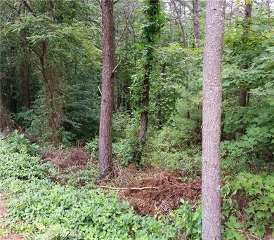 Plenty of Hardwoods and Privacy for your new Home.
