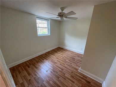Cozy Bedroom with closet on the right. p.s. this image shows the old flooring. New weathered grey plank flooring is installed currently.