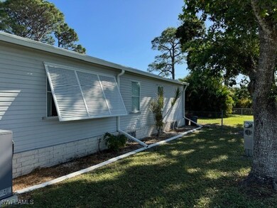View of property exterior featuring a lawn