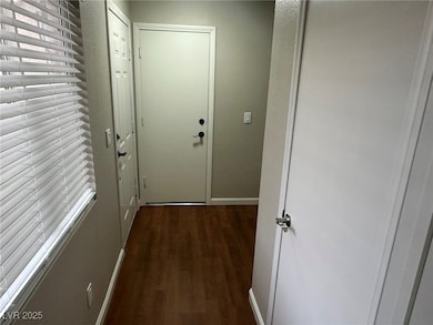Entryway featuring wood finished floors and healthy amount of natural light