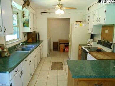 All appliances stay. Tile floors.
