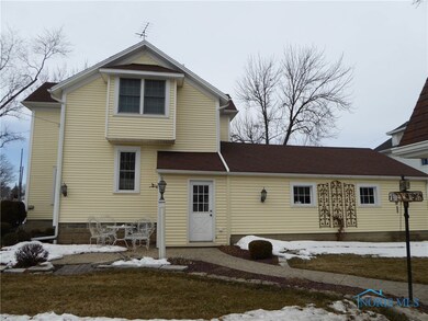 Rear view of the house and stamped concrete patio