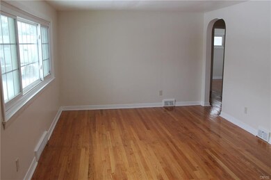 Living Room with Refinished Hardwoods Throughout