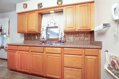 Kitchen featuring sink and tasteful backsplash