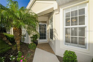 Inviting front entrance surrounded by beautiful pl