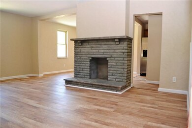 Open Living Room w/Laminated Floors, Decorative Fi