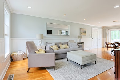Foyer flows to living room through french doors. Also with recessed lighting.