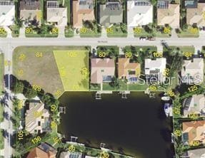 Aerial in yellow shows approximate boundary lot lines. Waterfront is 70 Ft.