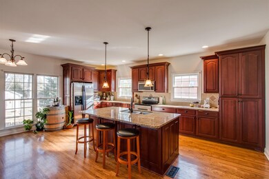 Kitchen with granite counters and custom cherry cabinets