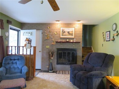 Living Room with propane fire place and Hardwood u