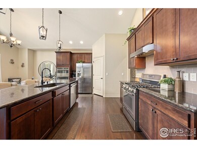 Gather Around the Large Kitchen Island & Enjoy the Convenience of Double Ovens & Microwave/Convection Oven