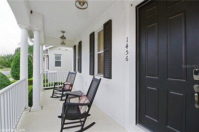 Covered Front Porch w/Wood Spindle Railing.