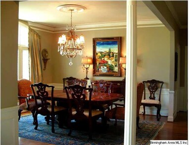 Large dining room with triple front window, heavy 
