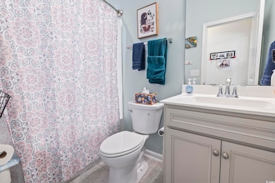 Full bathroom with vanity and toilet