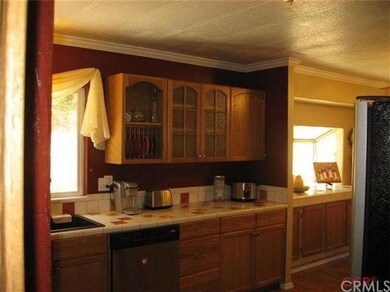 Kitchen is cozy, nice cabinets, and countertops.  