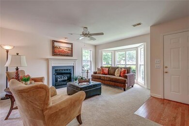 Home has fresh paint and new carpet throughout. Hardwood entry foyer. Living room has lots of natural light. 