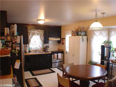 Kitchen - Vinyl flooring, door to deck, bay window
