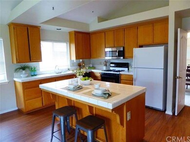 Kitchen features high ceilings, island, lots of ca