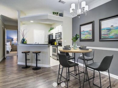 Kitchen featuring crown molding, stainless steel a