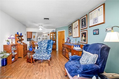 Home office featuring ceiling fan, a textured ceil