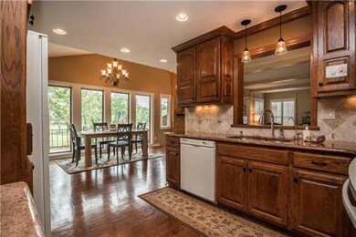 Gleaming hardwood floors and custom raised panel oak cabinetry.