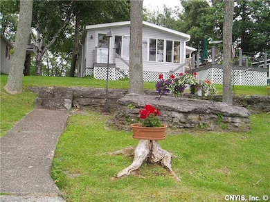 Exterior Front. Notice the spacious deck! Oh the m