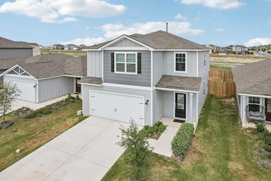 View of front of house with roof with shingles, a residential view, concrete driveway, a garage, and board and batten siding