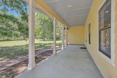 JUST IMAGINE BEING ABLE TO ENJOY YOUR MORNING COFFEE OR EVENING TEA ON YOUR SWING/ROCKERS ON THIS SPACIOUS COVERED FRONT PORCH