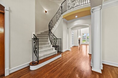 Even the staircase exudes elegance, featuring a ha