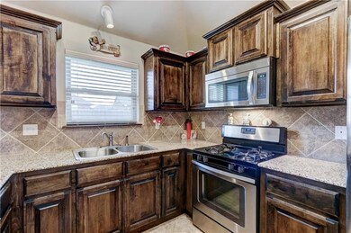 Kitchen offers gorgeous custom cabinetry, stainles