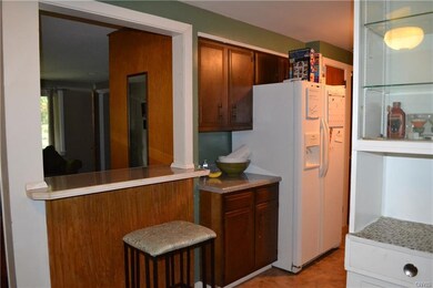 The kitchen features a breakfast bar that overlook