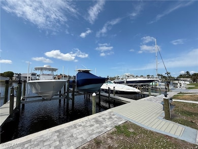 Dock with boat lift and a water view
