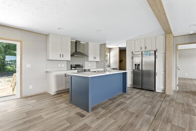 Kitchen with stainless steel appliances, an island