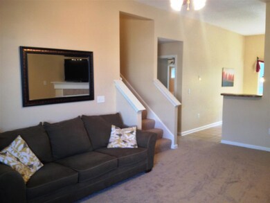 Stairs lead to the two additional bedrooms with a 