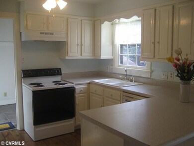 Kitchen - The updated kitchen has a breakfast bar 